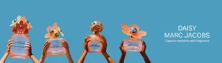 Various Marc Jacobs Daisy perfumes held by hands, showcasing options to match individual vibes