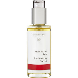 Bottle of Dr. Hauschka Rose Body Oil, 2.5oz, surrounded by fresh roses.