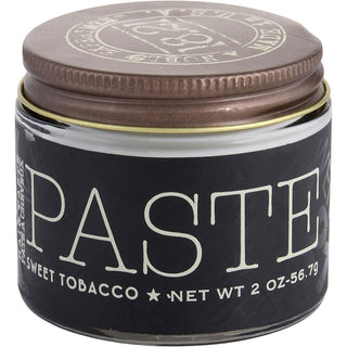 18.21 Man Made Hair Paste Sweet Tobacco 2oz tin with a matte finish and signature scent.