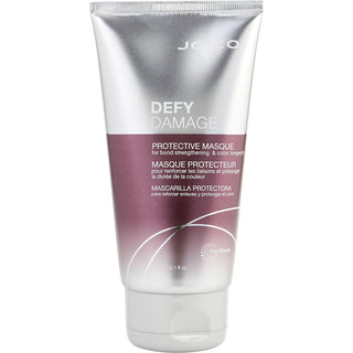 Joico DEFY DAMAGE PROTECTIVE CONDITIONER 33.8 OZ bottle on an elegant bathroom counter.