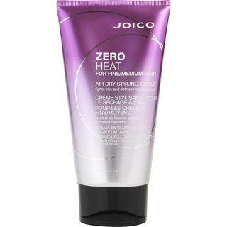 Joico COLORFUL ANTIFADE CONDITIONER 33.8 OZ bottle on a stylish bathroom shelf.