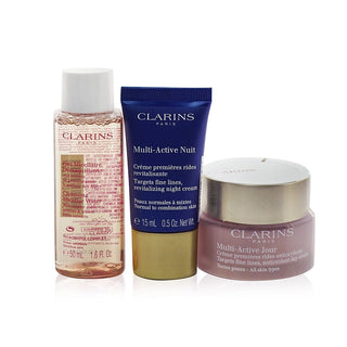 Clarins Multi-Active Collection with Day Cream, Night Cream, Cleansing Micellar Water, and Bag.