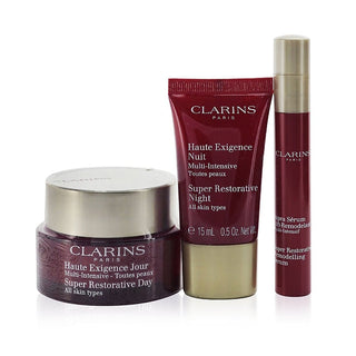 Clarins Super Restorative Collection: Day Cream, Night Cream, Remodelling Serum, and Bag. Buy now at fragrancedealz.com