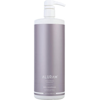 A sleek, 33.8oz bottle of Aluram Clean Beauty Collection Daily Conditioner with a minimalist design, set against a backdrop of hydrating botanical elements.