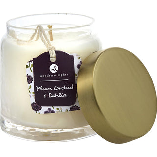 A 10 oz glass soy candle with a label reading "Plum Orchid & Dahlia