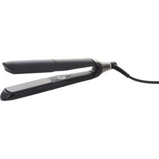 A sleek, black GHD Glide Hot Brush with ceramic technology and an ergonomic design for easy smoothing and straightening.