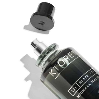 511 Black Tie with an open cap reveals its captivating scent, available at fragrancedealz.com