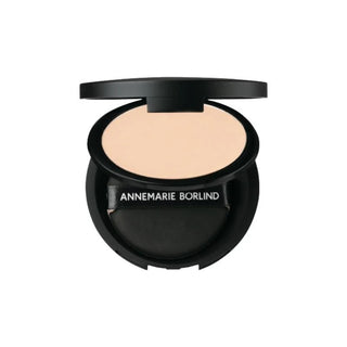 Annemarie Borlind Compact Powder in Light is opened, featuring a sponge inside for effortless application and a smooth, natural finish. Available at fragrancedealz.com