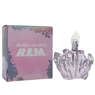 Ariana Grande R.E.M. perfume bottle and box, with the bottle featuring a star-shaped design and the box showcasing a colorful, starry theme. Both elements reflect a whimsical and elegant style. Available at fragrancedealz.com