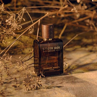 Immerse yourself in the wild elegance of Citizen Jack Absolute, with its iconic bottle placed amidst the serene beauty. Available now at FragranceDealz.com.