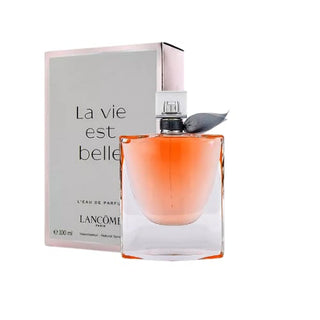 La Vie Est Belle by Lancôme Perfume bottle in front of its elegant box, showcasing a delightful blend of iris, patchouli, and sweet gourmand notes for women, available on Fragrancedealz.com