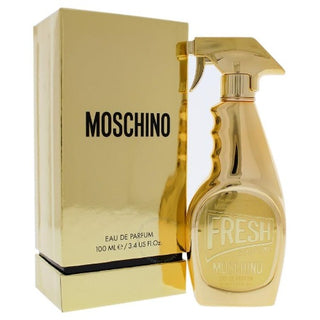 Moschino Fresh Gold Couture Perfume bottle and box. The bottle showcases a luxurious gold design with elegant accents, while the box features matching gold details and branding. Available at fragrancedealz.com.