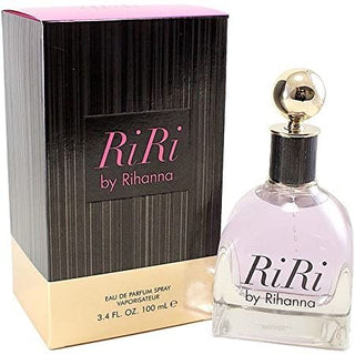 Side view of the Ri Ri Perfume bottle, highlighting its chic and glamorous design. The fragrance reveals notes of passion fruit, jasmine, and orange blossom, creating a vibrant and sensual scent. Available at fragrancedealz.com.