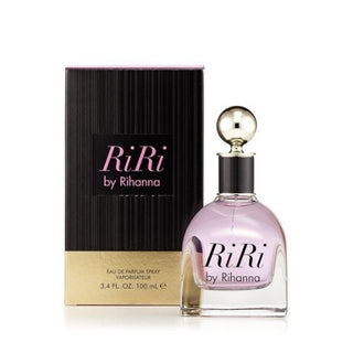 Ri Ri Perfume bottle and box. The bottle showcases a chic and glamorous design, while the box features stylish branding and accents. The fragrance reveals notes of passion fruit, jasmine, and orange blossom, creating a vibrant and sensual scent. Available at fragrancedealz.com.