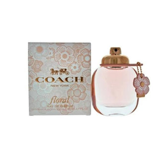 Coach Floral Perfume bottle and box. The bottle showcases a chic and sophisticated design, complemented by the stylish packaging of the box. Available at fragrancedealz.com.