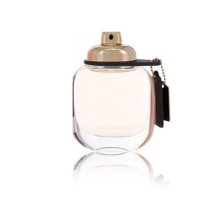 Coach Perfume bottle featuring a sleek and elegant design. The fragrance reveals notes of vibrant raspberry, delicate rose, and warm musk, creating a timeless and sophisticated scent. Available at fragrancedealz.com.